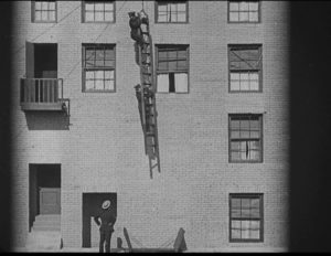 Buster Keaton on a dangling ladder